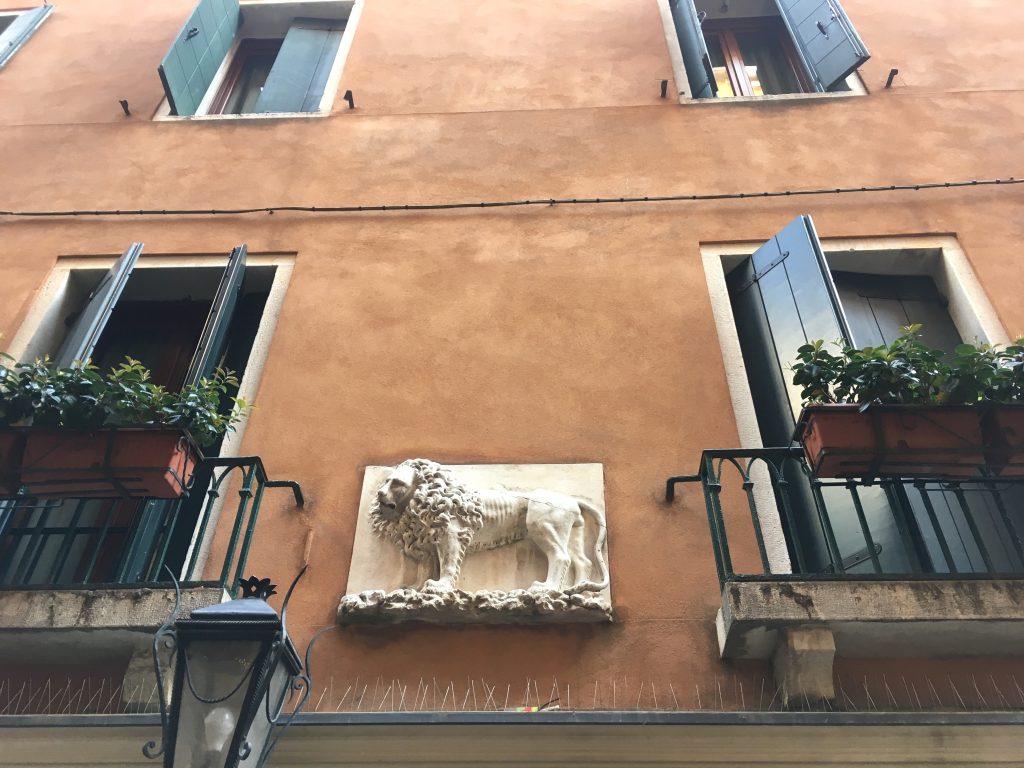 lion of St. Mark sculpture on house wall
