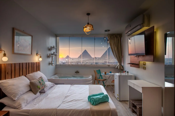 a room in Cairo with beautiful view of the Pyramids of Giza