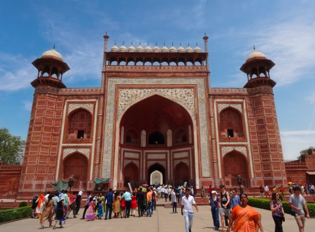 the crowd is rushing to the main gate to enter the Taj Mahal site