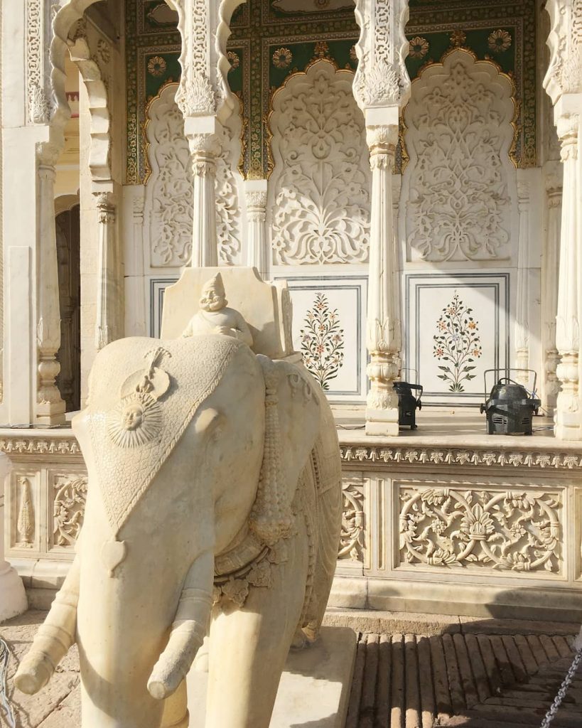 marble details with an elephant and a Maharaja statue inside the City Palace of Jaipur