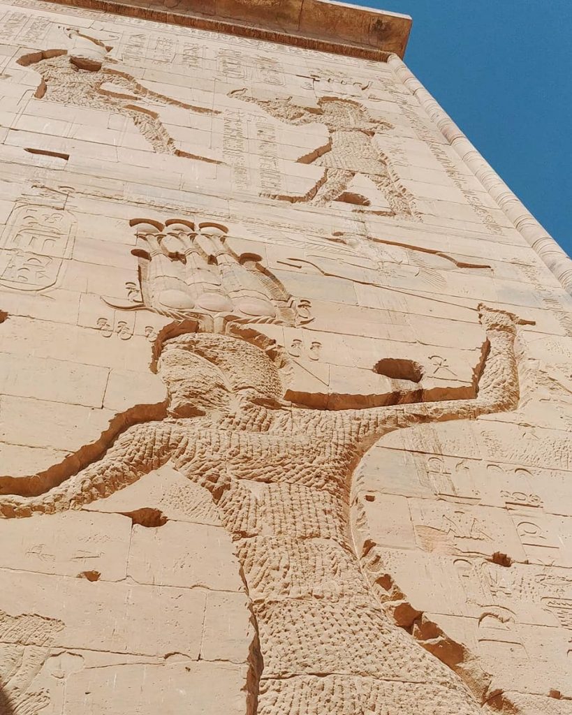 a detail of the hieroglyphs on the main entrance of Philae Temple in Aswan