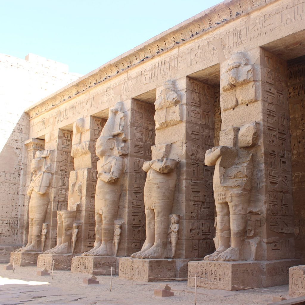 ancient sculpture of statues at Medinet Habu Temple - Luxor