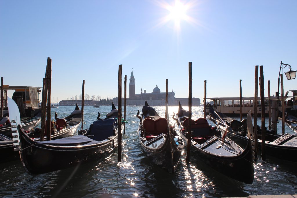 beautiful gondolas on the river bank of Venice