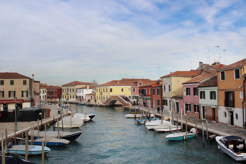 a canal view with colorful houses in Murano Island - Venice