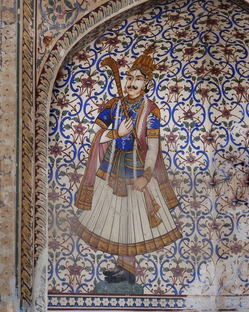 a maharaja painting at the entrance of the city palace of Jaipur