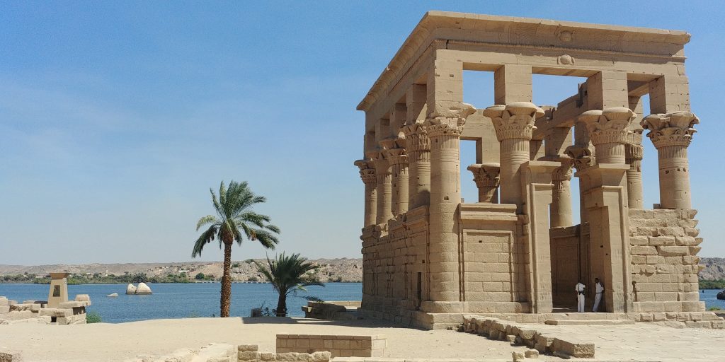 Philae Temple architecture with river Nile backdrop - Aswan